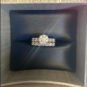 1.02 Carat Round Brilliant Cut with 13 diamond band.